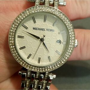 Michael Kors watch with a large round white face